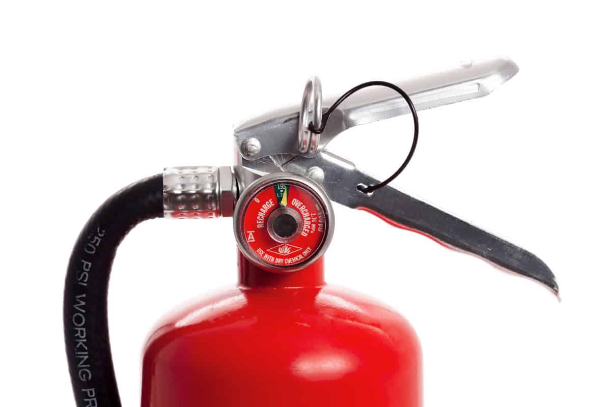 how-to-start-a-fire-pit-equipment Image of a fire extinguisher for a post on how to put out a fire pit.