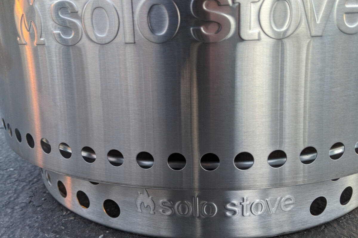solo-stove-got-rained-on-resilience Image of the front of a fire pit sitting on its base.