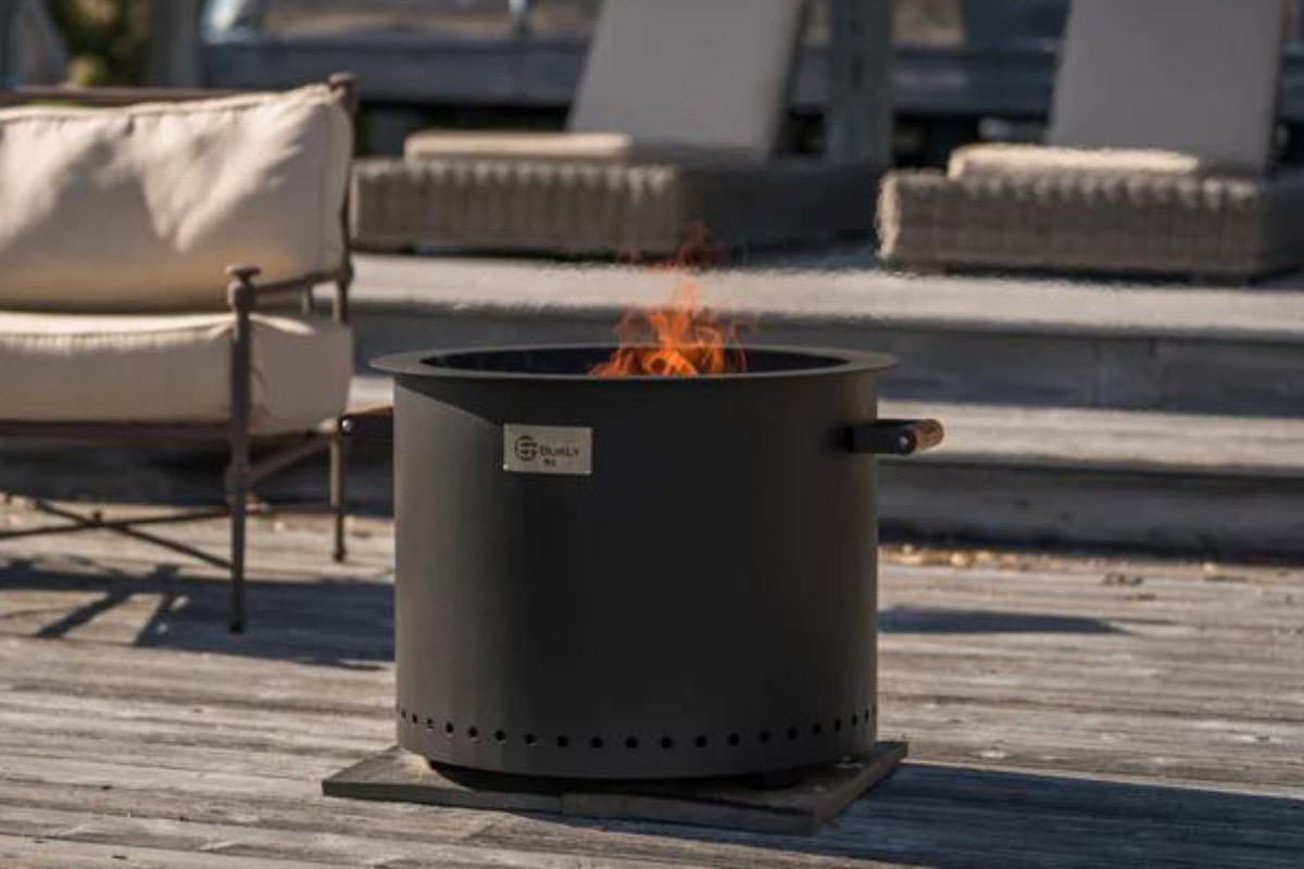 city-fire-pit-rules-equipment Image of a smokeless fire pit sitting on an urban patio.