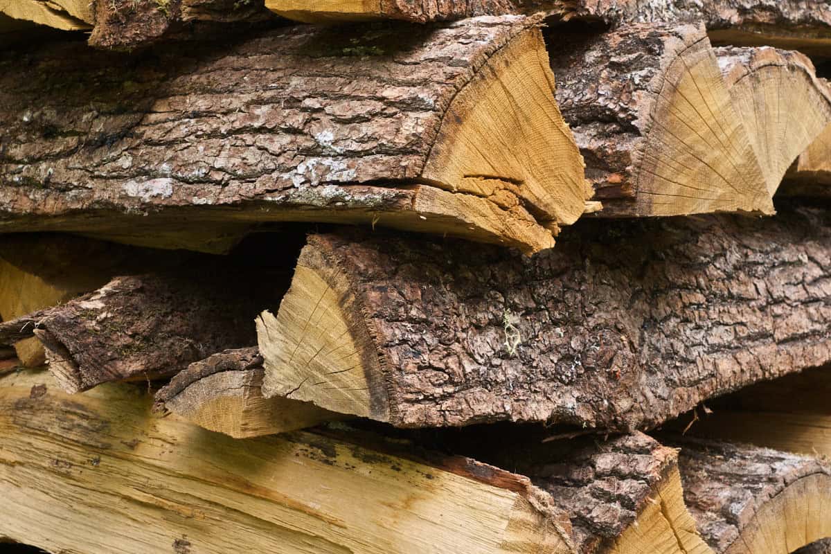 kiln-dried-firewood-for-fire-pits-closing Image of a log cabin stack of firewood.
