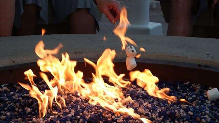 Imaged of roasting marshmallows over a propane fire pit