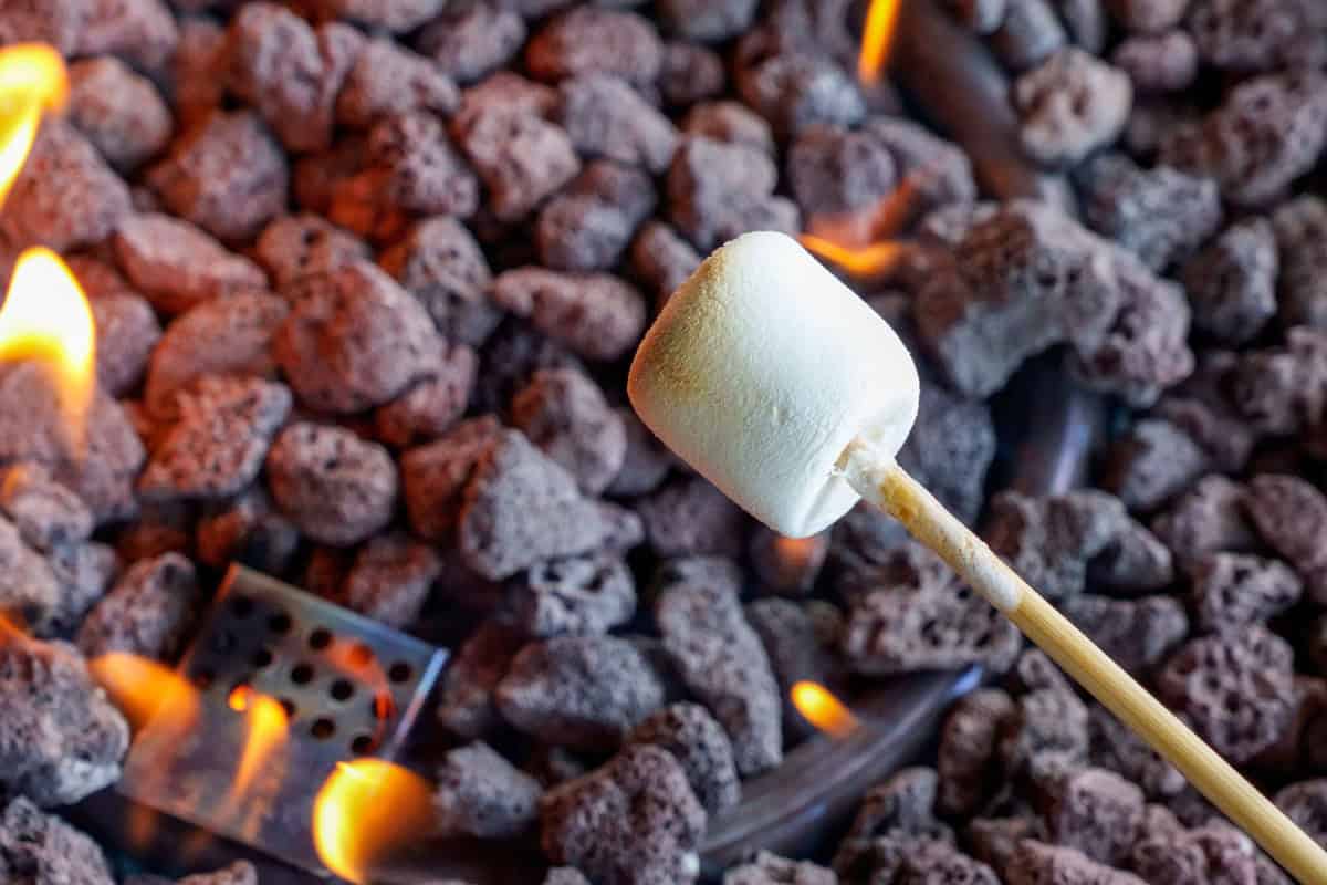 marshmallows-over-a-gas-fire-pit-main Image of marshmallows roasting for a blog post about roasting marshmallows over a gas fire pit.