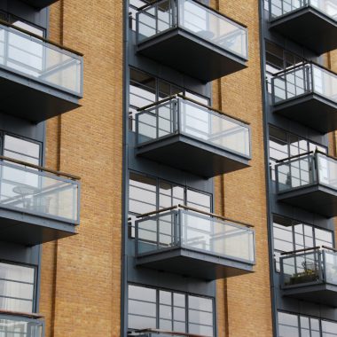 Image of apartment balconies for a blog post covering using a fire pit on a balcony.
