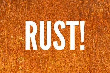Image of the word rust with a rusty fire pit background