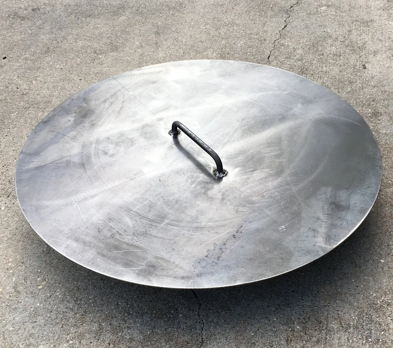 Image of a steel fire pit snuffer or lid