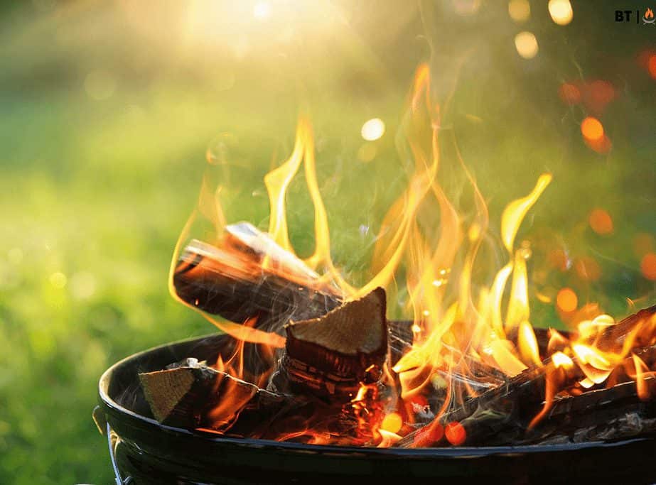 Image of a burning fire pit on grass