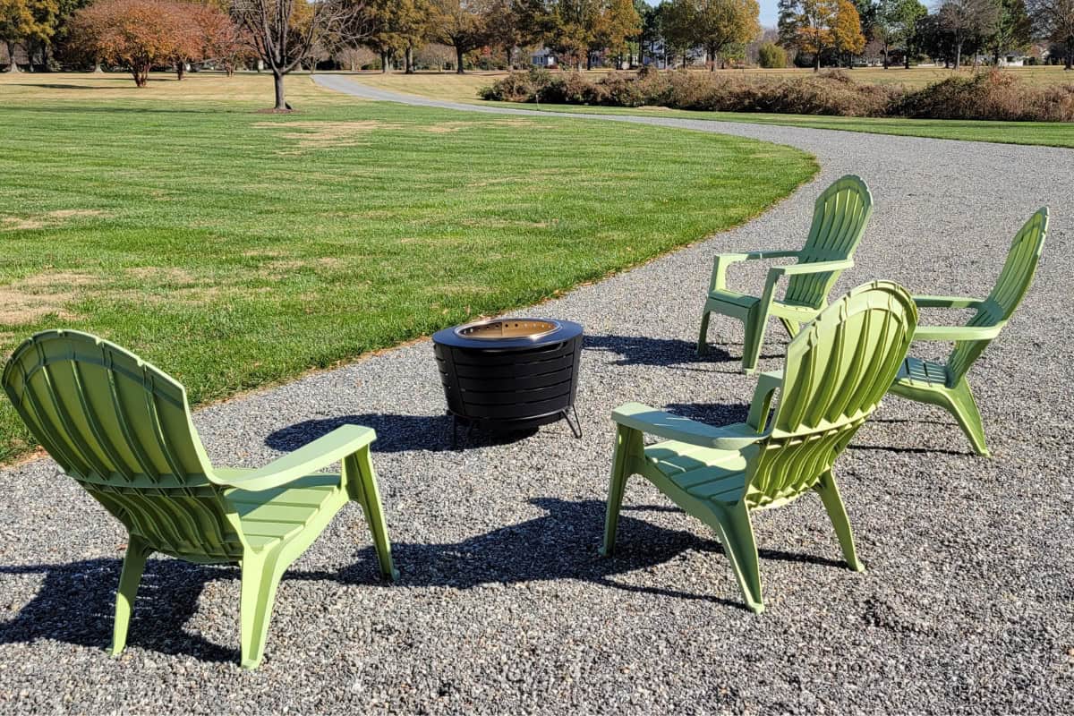 fire-pit-benefits-affordable Image of a smokeless fire pit on gravel surrounded by chairs for a blog post covering the benefits of a fire pit.
