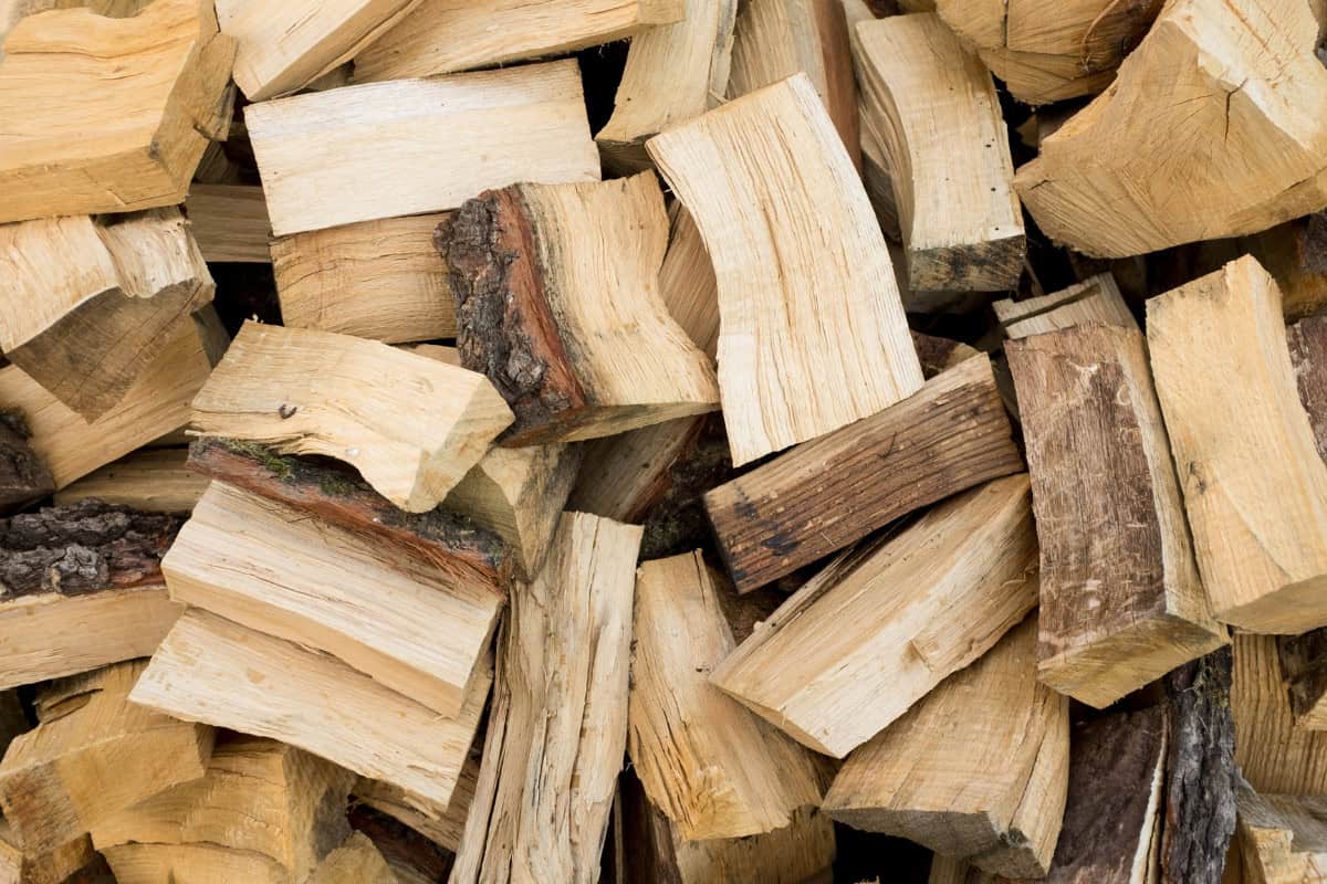 seasoned-firewood-closing Image of a stack of freshly chopped beech firewood for a blog post covering seasoned firewood.