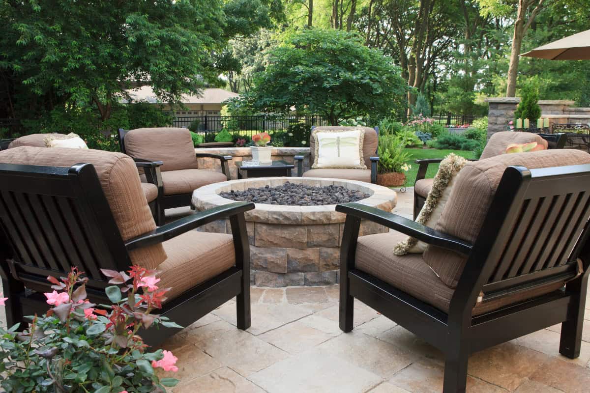 Heat-Resistant Bonding: A Guide to Fire Pit Adhesives Image a stone block fire pit on a patio for an article covering fire pit adhesives.