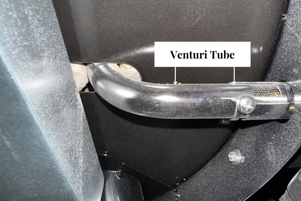 gas-fire-pit-whistles-causes Image of the venturi tube for a portable propane fire pit.