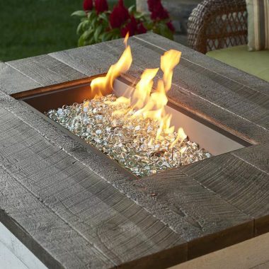 Image of a burning rectangular propane fire pit for a blog post about gas fire pit whistles.