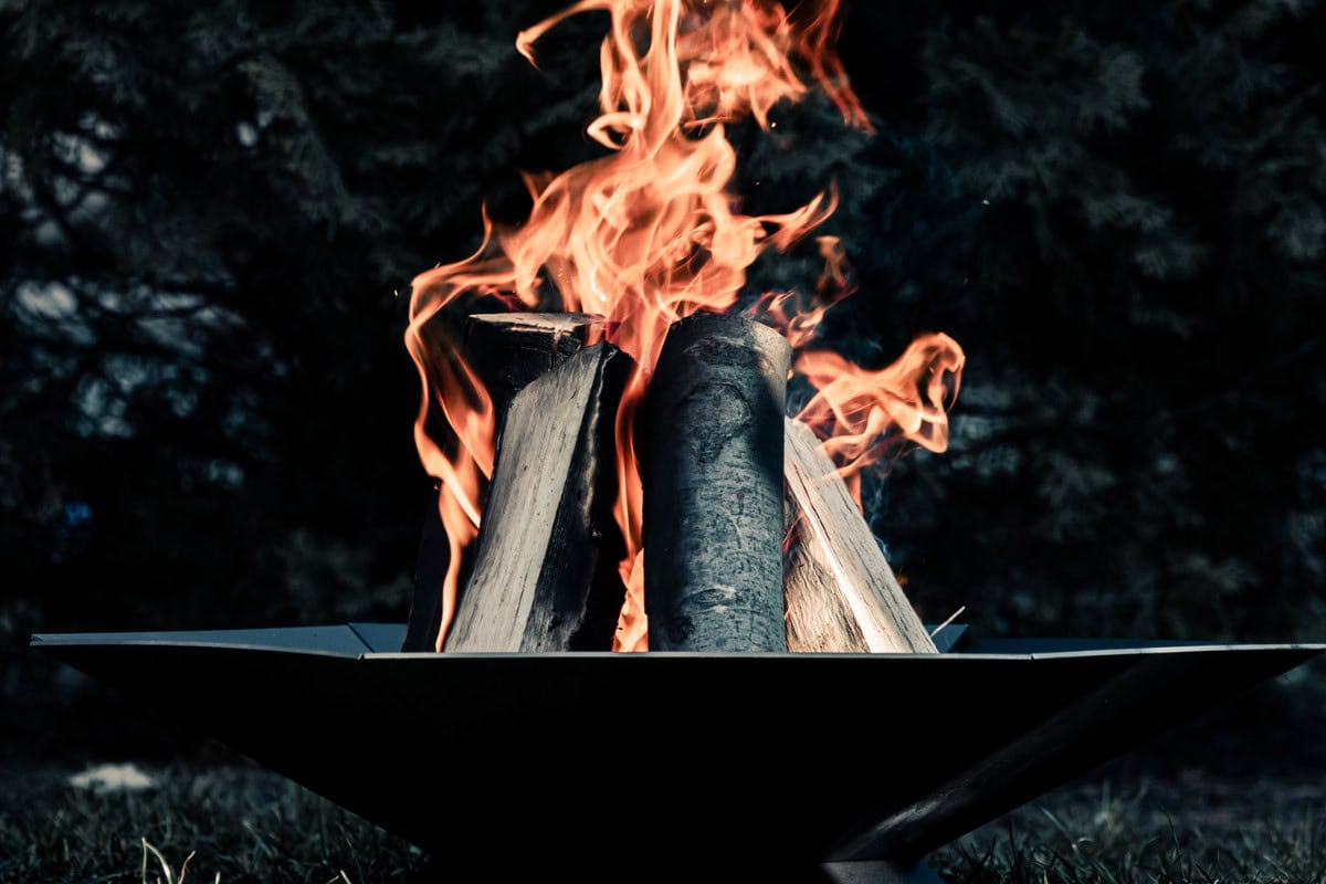Popular Fire Pit Diameter Choices and Their Uses Image of a large fire pit burning for a blog post answering the question "what size fire pit do I need?"