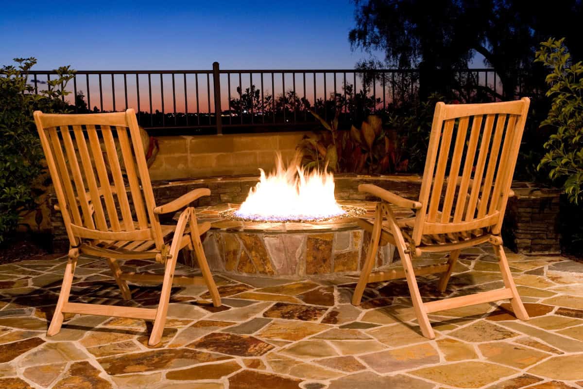 Choosing the Right Size for Your Space Image of a burning gas fire pit at dusk.