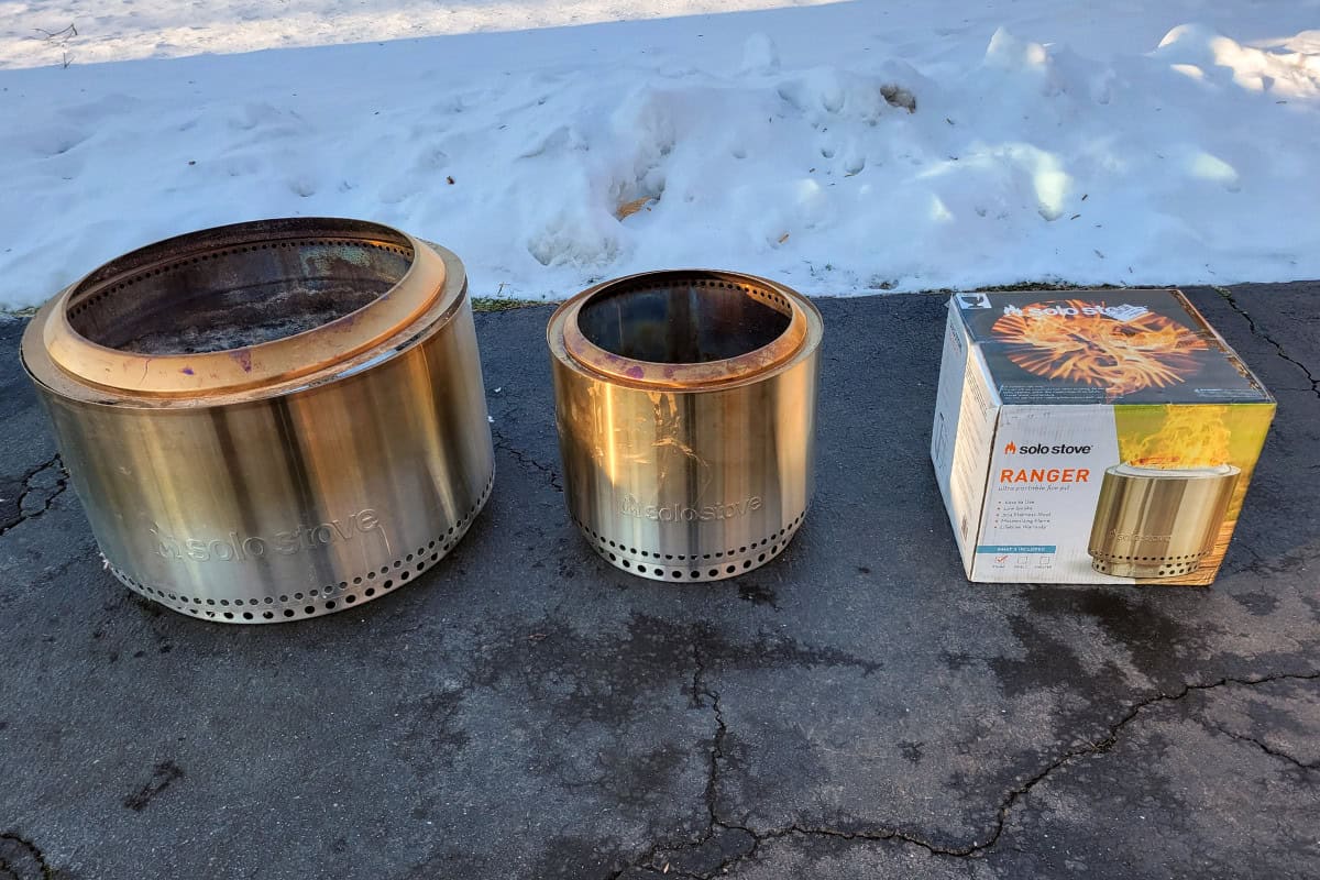 what-size-solo-stove-comparison Image of three Solo Stove models on an asphalt driveway with snow in the background.