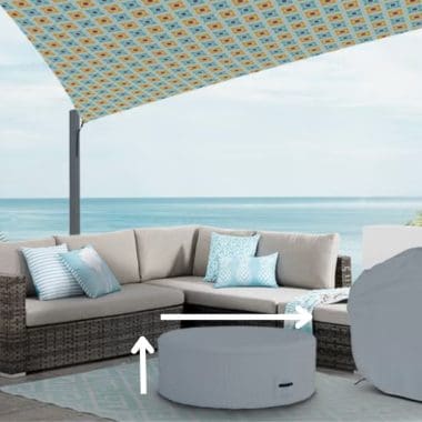 Image of a fire pit and furniture in a coastal scene for a blog post covering how to measure for a fire pit cover.