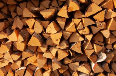 Image of neatly stacked firewood splits for a blog post covering U.S. firewood prices.