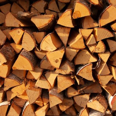 Image of neatly stacked firewood splits for a blog post covering U.S. firewood prices.