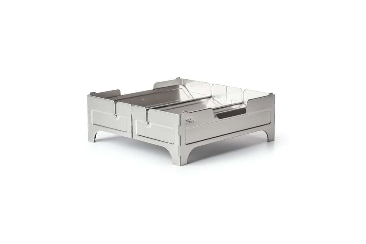 best-portable-fire-pits-wolf-and-brizzly-fire-safe Stainless steel backyard fire pit with protective sidewalls and sturdy base, perfect for outdoor gatherings and warmth in your backyard. Durable and stylish for outdoor entertainment.