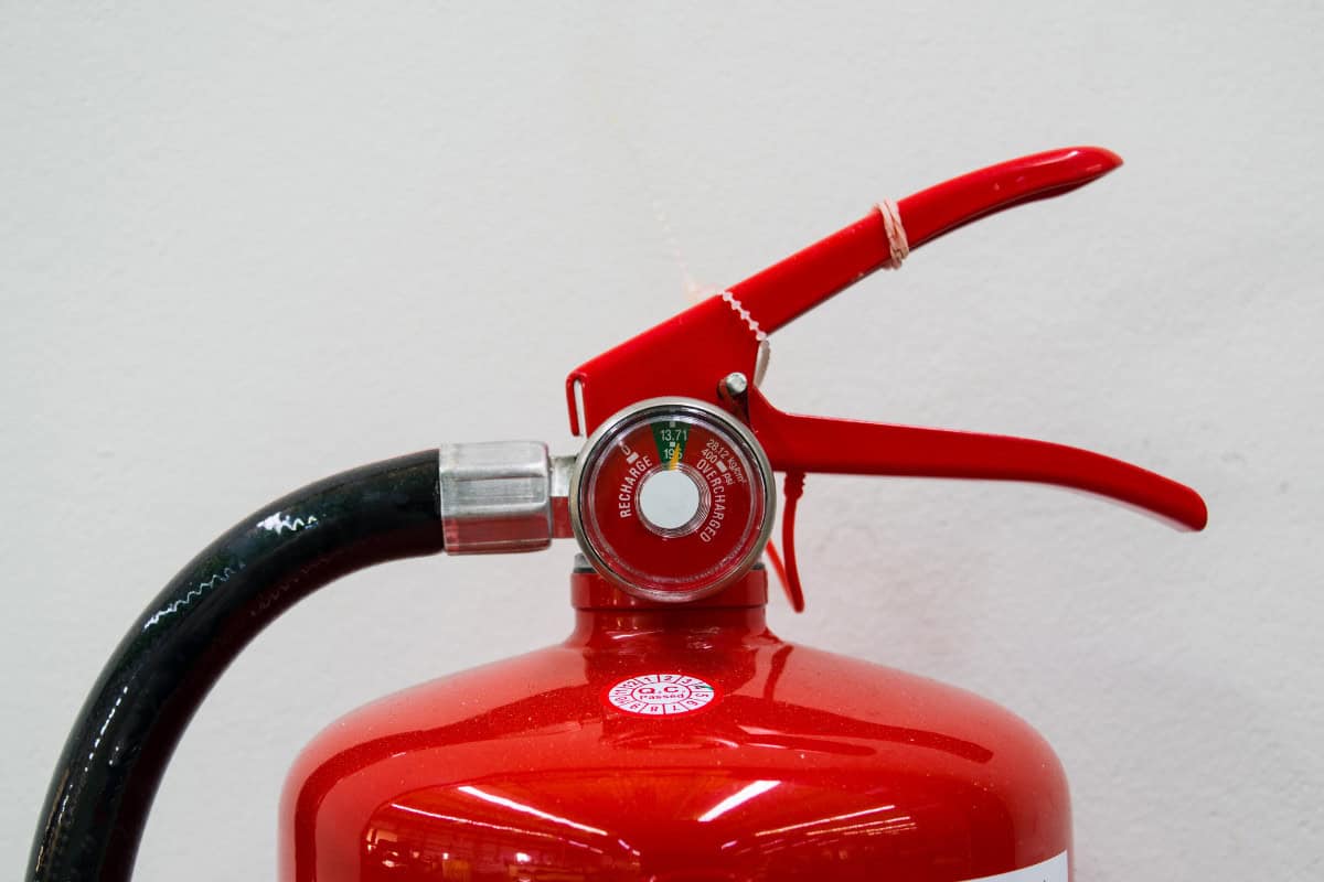 Image of the top of an ABC class fire extinguisher.