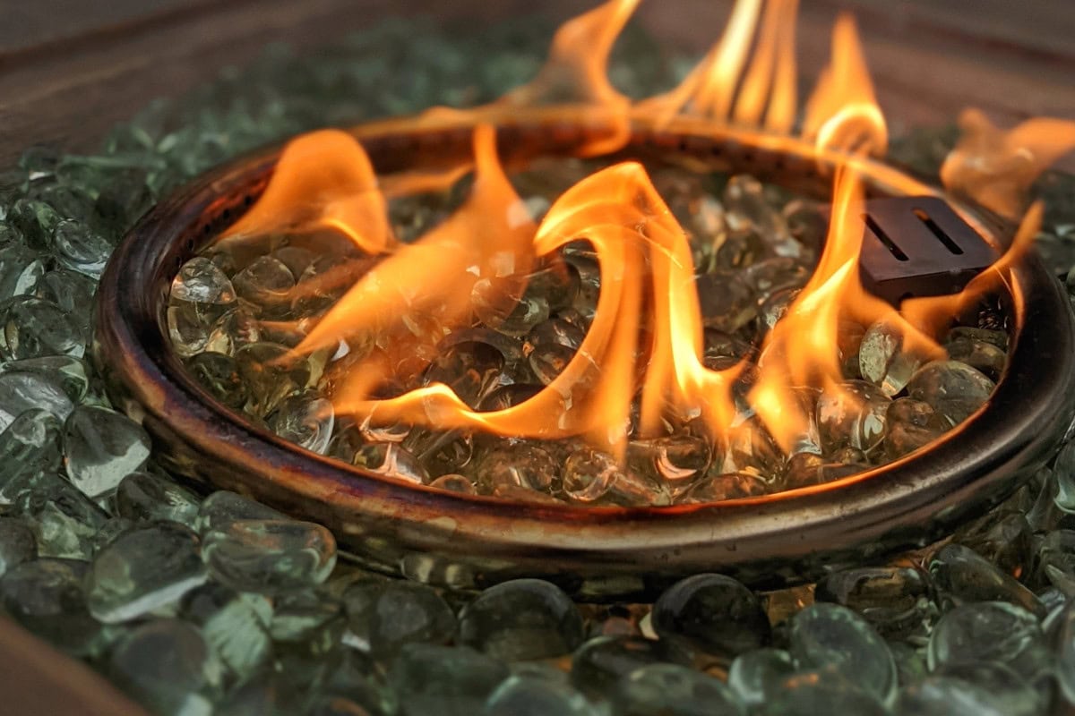 gas-fire-pit-keeps-going-out-troubleshooting Image of a gas fire pit burner and fire glass.