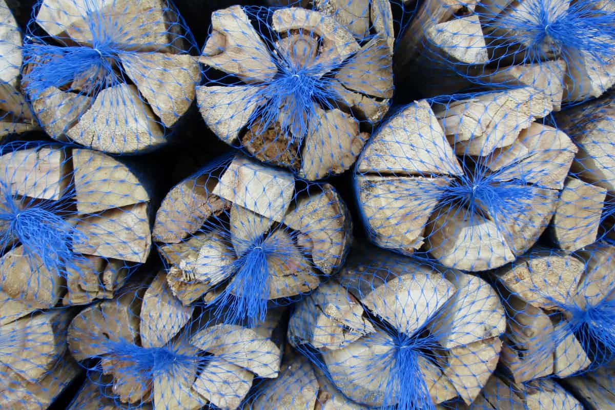 what-are-hardwoods-faqs Image of multiple bundles of kiln dried firewood for a blog post answering the question, 'what are hardwoods.