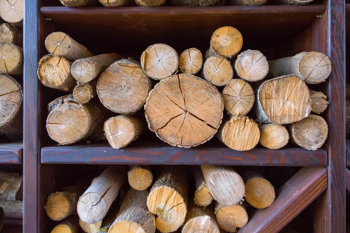 what-are-hardwoods-storage Image of well-seasoned wood rounds in a storage rack.