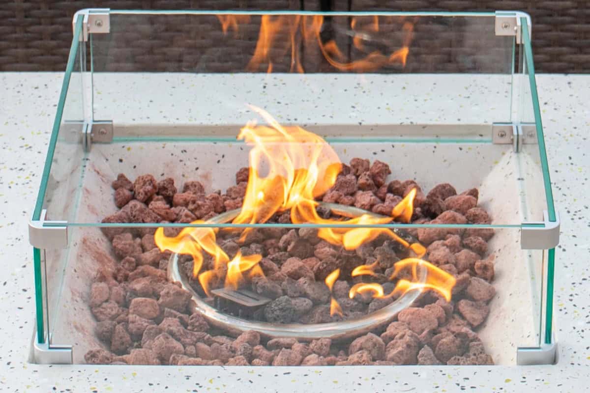 gas fire pit problems-environmental Outdoor fire pit with glass enclosure and propane burner, perfect for backyard heating and ambiance.